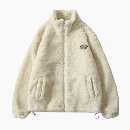 Détail de la fermeture éclair sur veste moumoute blanche