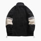 Veste noire en matière mouton avec bande contrastée