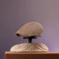 Gros plan sur un béret en coton avec texture visible