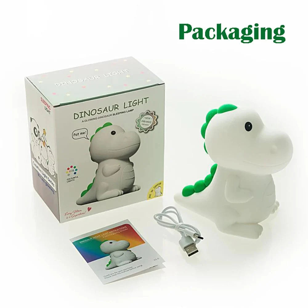Veilleuse dinosaure LED en silicone multicolore sur table de nuit