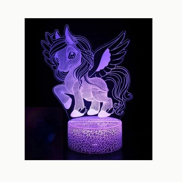 Veilleuse licorne LED sur une table de nuit