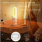 Veilleuse LED rechargeable posée sur une table en bois