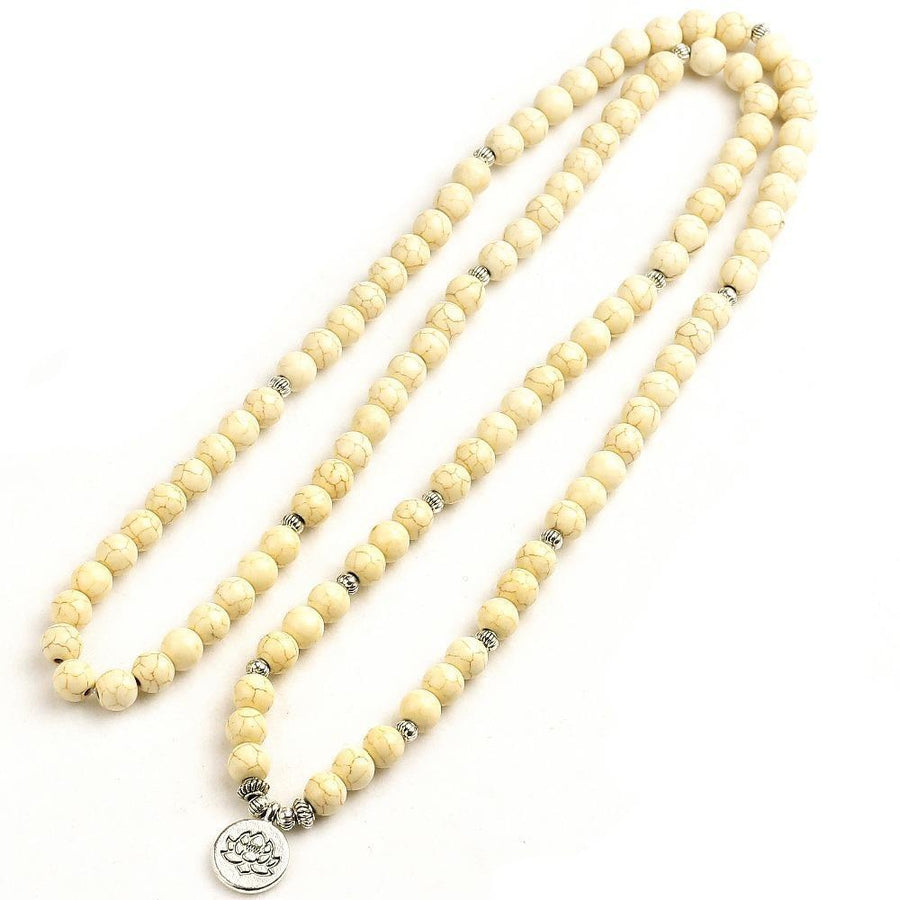 Mala 108 perles en howlite blanche avec charme lotus