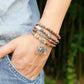 Focus sur le charm main de Fatma et les perles de jaspe