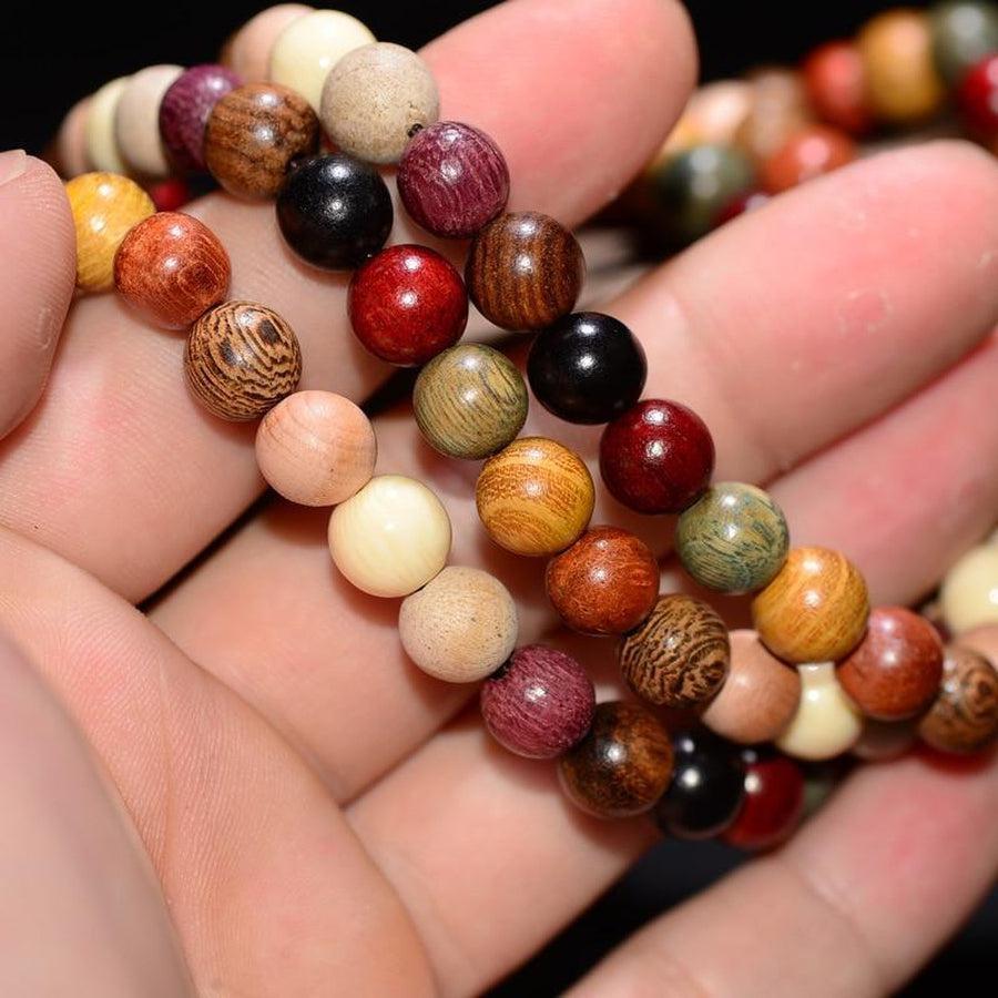 Mala en bois de santal avec 108 perles et charmes Bouddha