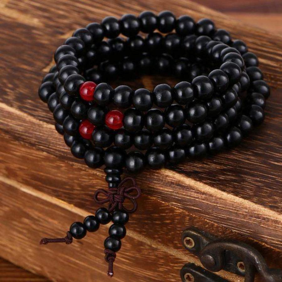 Perles de santal avec un cordon noué