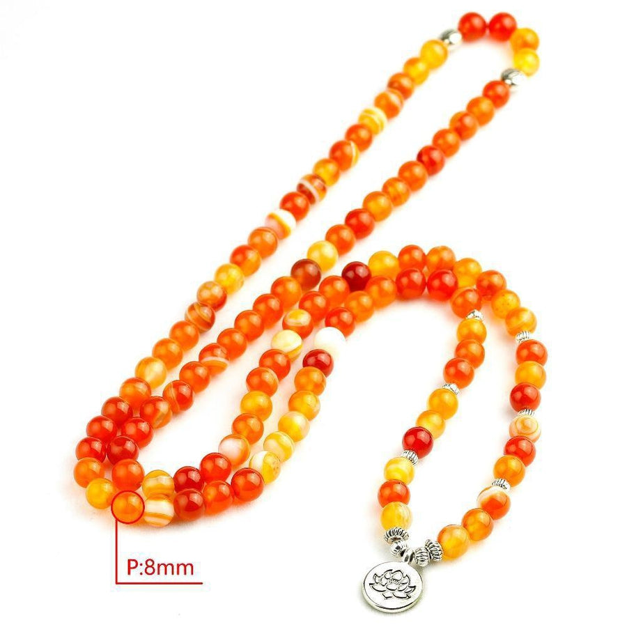 Mala en onyx marbre orange avec charme spirituel