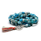 Mala en apatite bleue avec médaillon lotus gravé