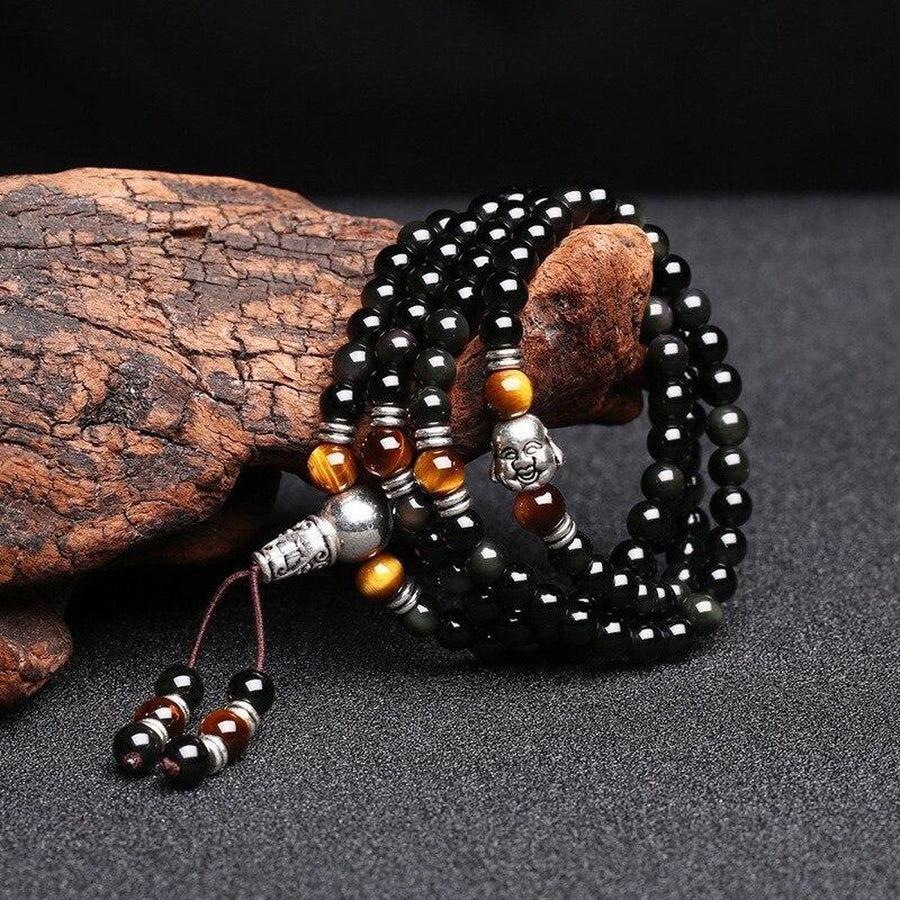 Mala en obsidienne et œil de tigre avec tête de Bouddha