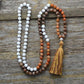 Vue d'ensemble du mala en agate et cuivre, 108 perles