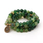 Mala en Onyx vert avec charme Fleur de Lotus