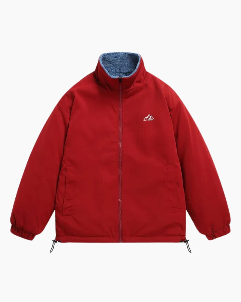 Manteau réversible bleu marine avec intérieur rouge visible