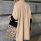 Gros plan sur la texture peluche du manteau beige