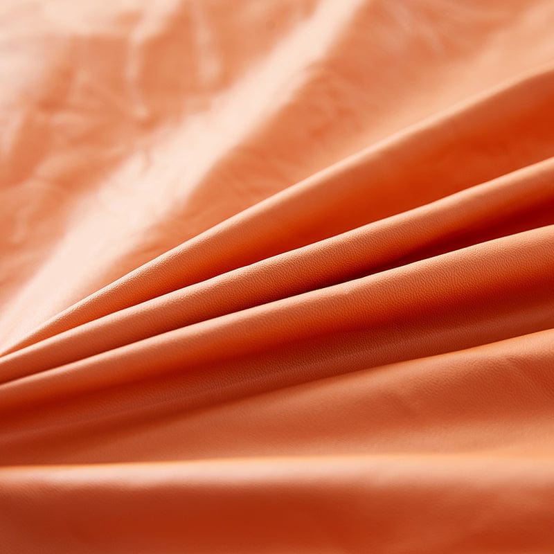 Détail de la texture simili cuir orange, gros plan