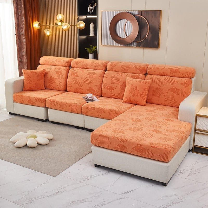 Housse polaire orange avec motif ours sur coussin de canapé