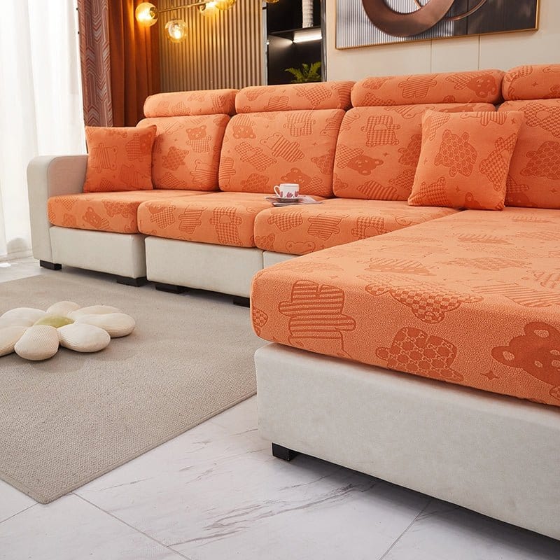 Vue latérale de la housse polaire orange avec motif ours