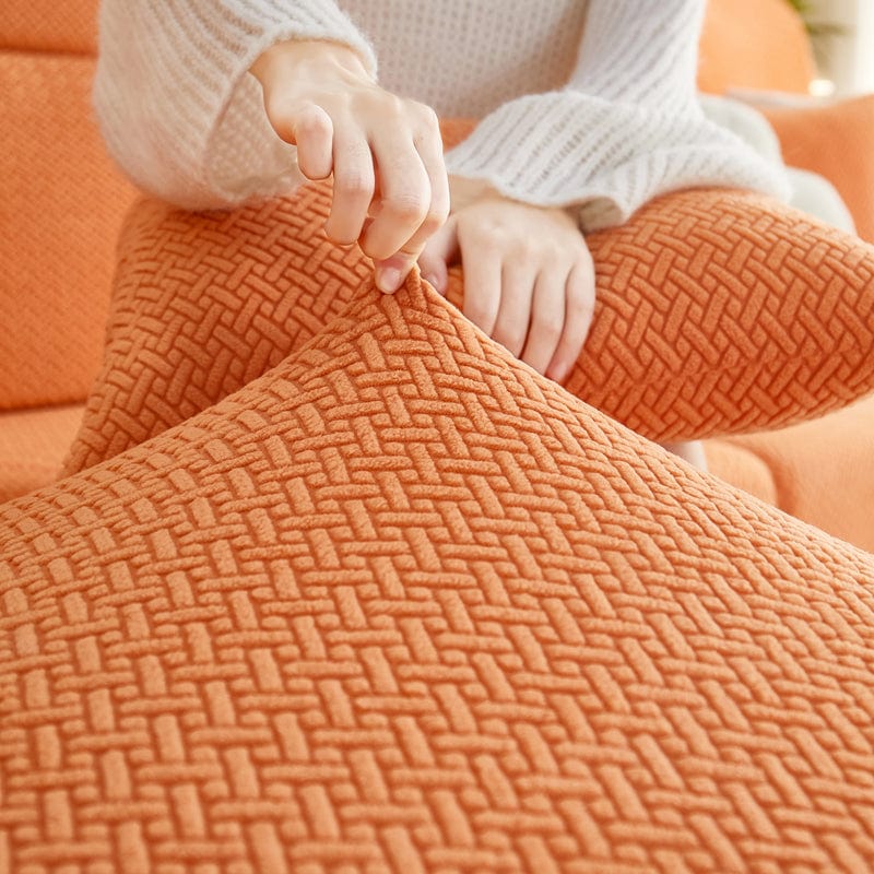 Housse polaire orange avec motif laine sur coussin