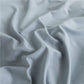 Texture du tissu doux et résistant des draps bleu ciel