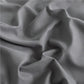 Détail du design coordonné de l'ensemble de lit gris