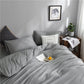 Drap-housse gris clair avec coins élastiques pour matelas