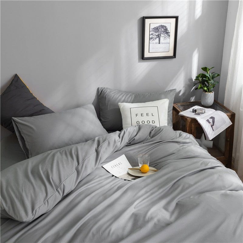 Drap-housse gris clair avec coins élastiques pour matelas