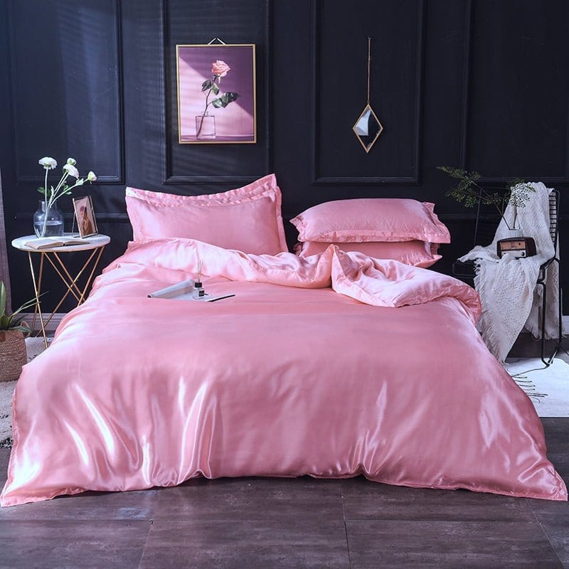 Parure de lit satinée rose avec motifs subtils
