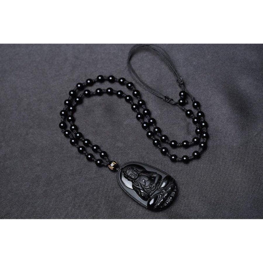 Vue latérale du pendentif obsidienne, mettant en valeur la texture