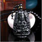 Pendentif Bouddha en obsidienne sur fond blanc