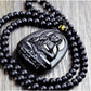 Collier de perles noires avec pendentif Bouddha