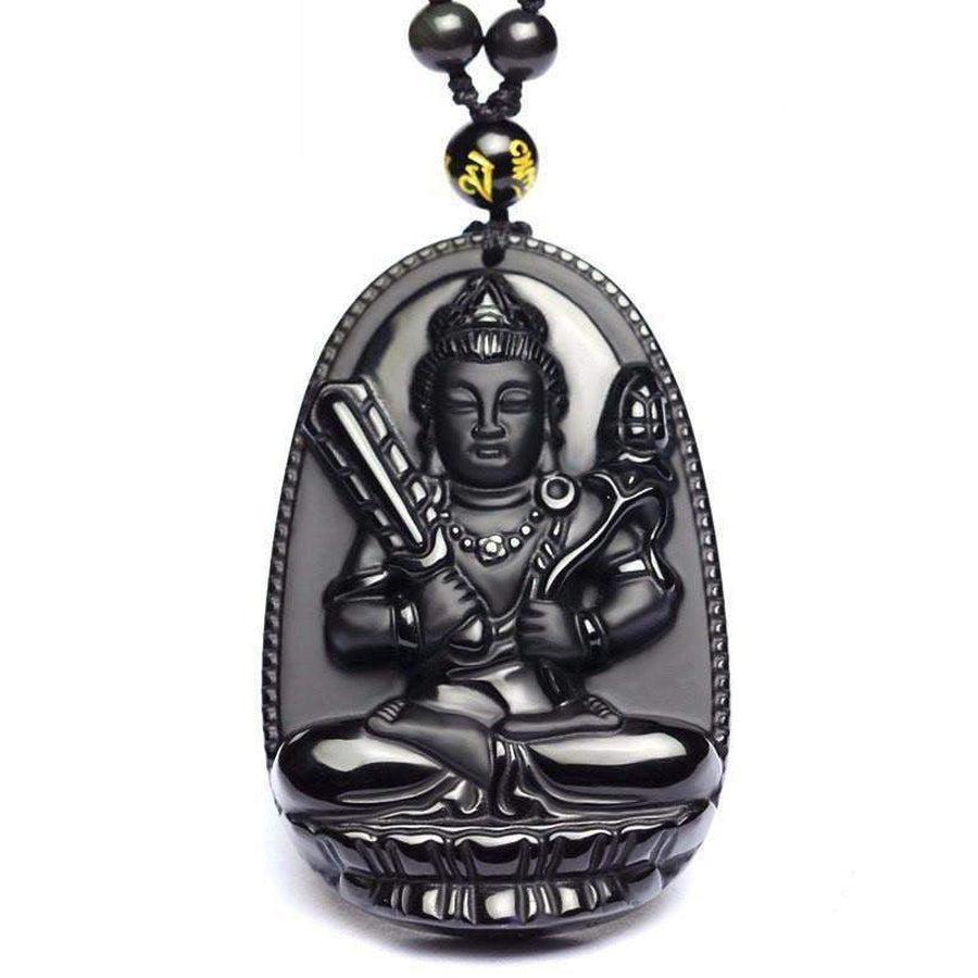 Vue rapprochée d'un pendentif Bouddha en obsidienne