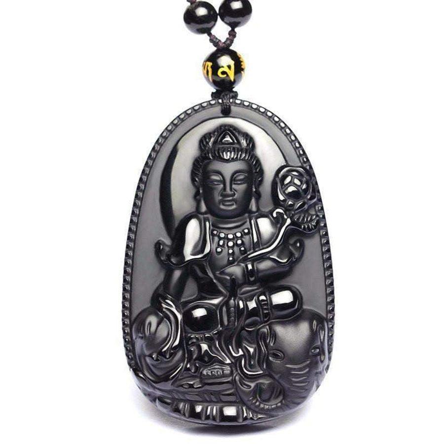 Vue latérale d'un pendentif Bouddha en obsidienne