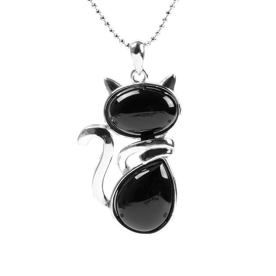 Vue de profil du pendentif chat et pierre marron