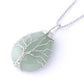 Cristal de roche dans un pendentif arbre de vie