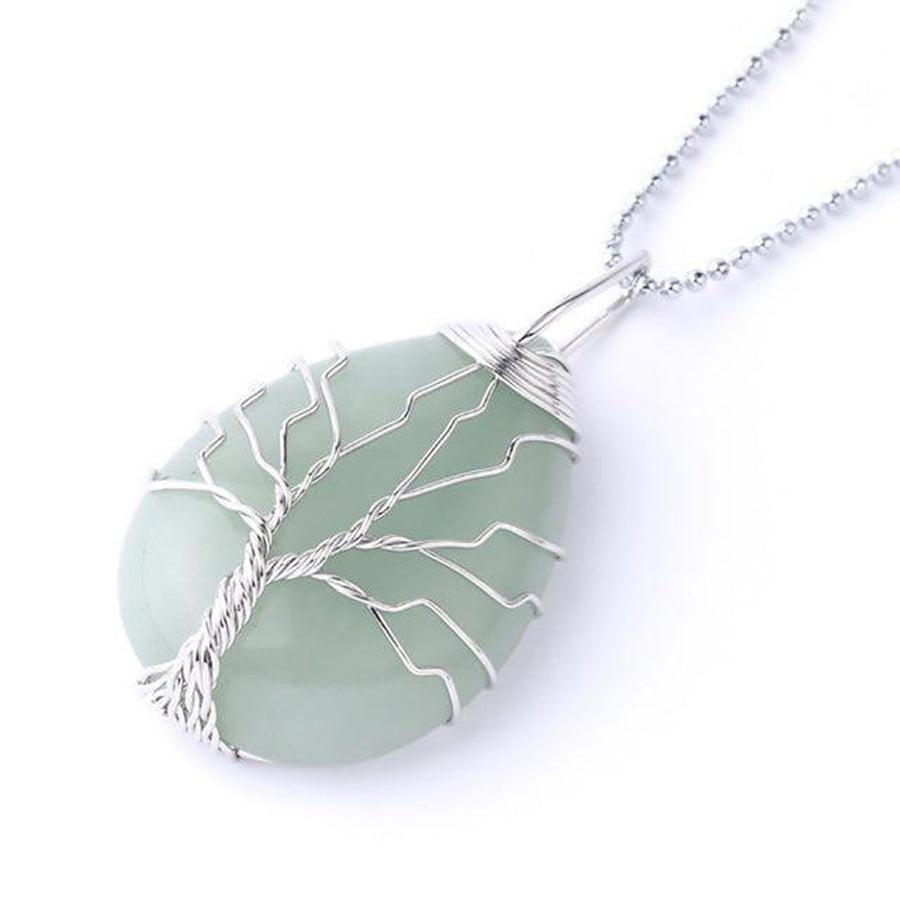 Cristal de roche dans un pendentif arbre de vie
