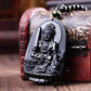 Vue rapprochée du pendentif Bouddha, obsidienne polie