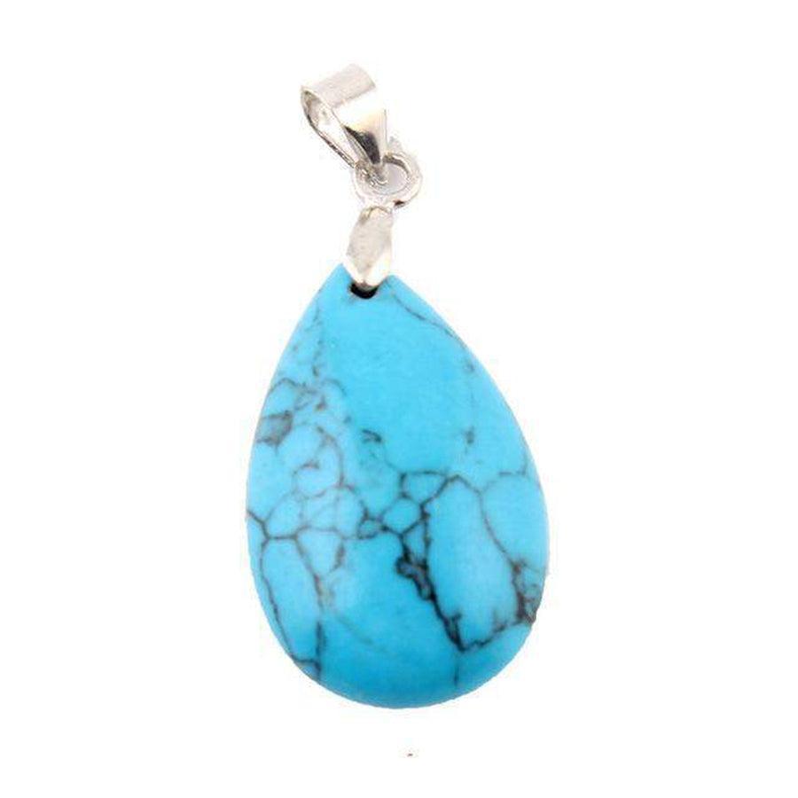 Collection de pendentifs en pierres variées sur fond blanc