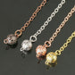 Pendule or rose en spirale avec mousqueton homard