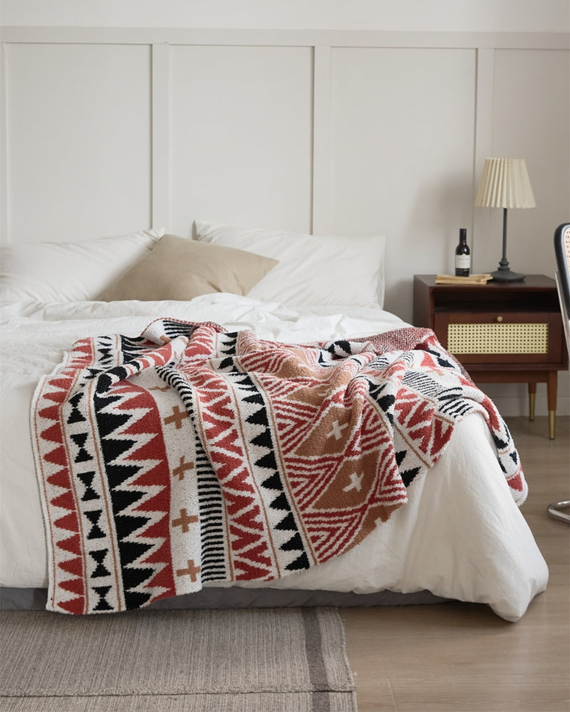Vue d'ensemble du plaid étalé sur un lit