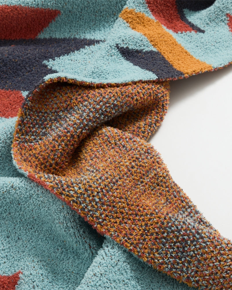 Plaid replié, montrant les motifs colorés