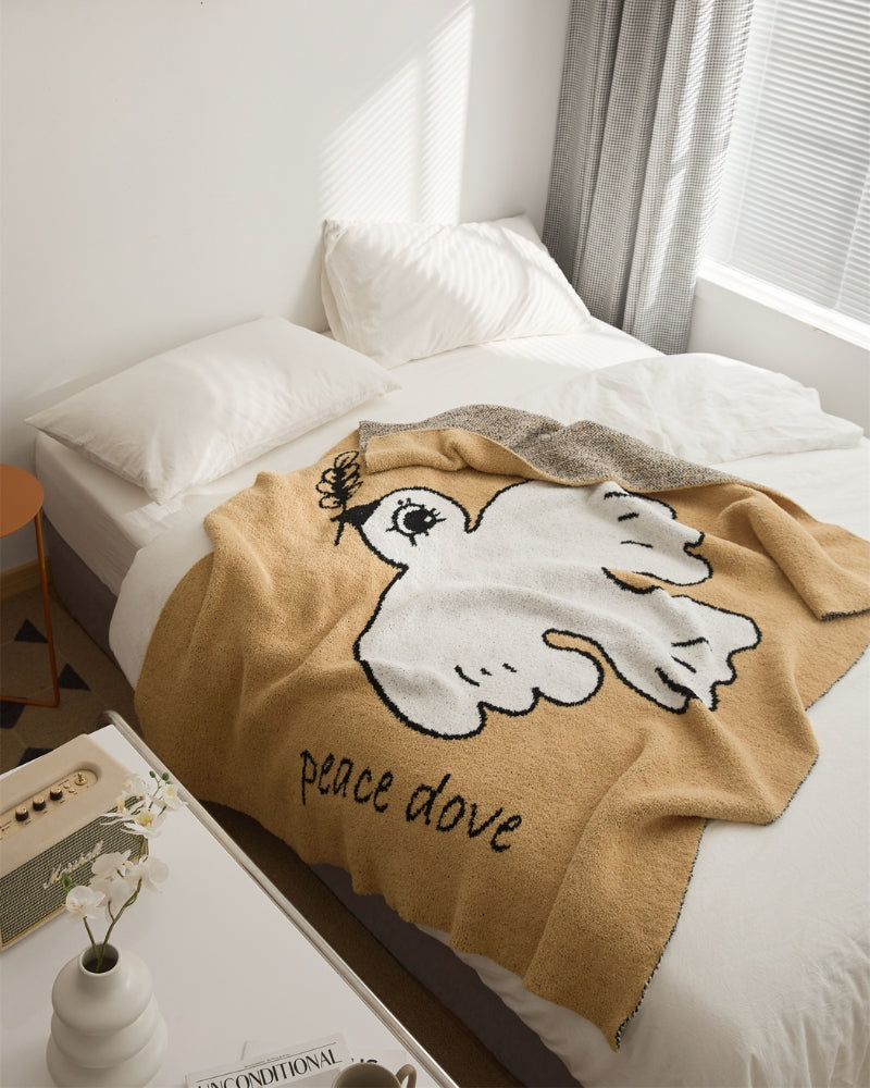 Plaid en fourrure synthétique beige avec motif oiseau blanc