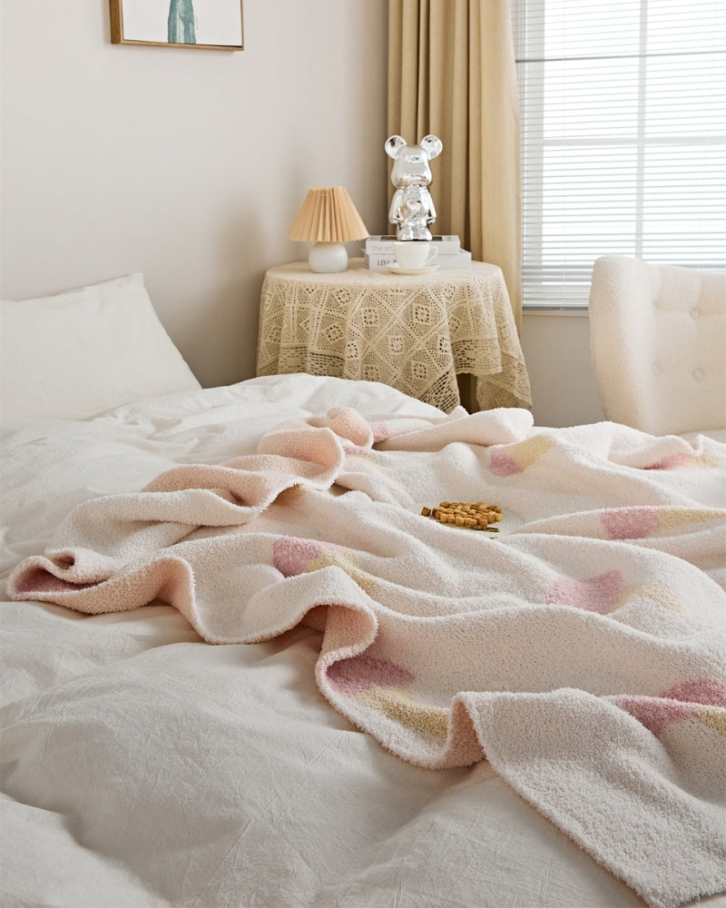 Plaid matelassé rose pâle avec motifs de glace