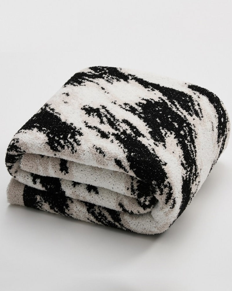 Détail des dégradés noirs et beiges du plaid