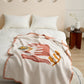 Gros plan sur le motif rose du plaid