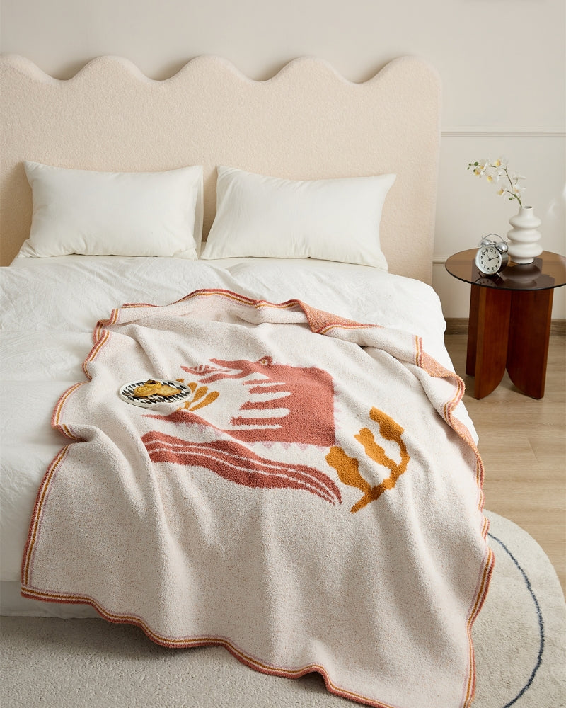 Gros plan sur le motif rose du plaid
