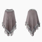 Poncho ample porté avec jean et bottines