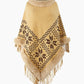 Poncho porté avec jean et bottines, vue en pied