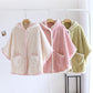 Poncho pyjama blanc et rose avec capuche et boutons