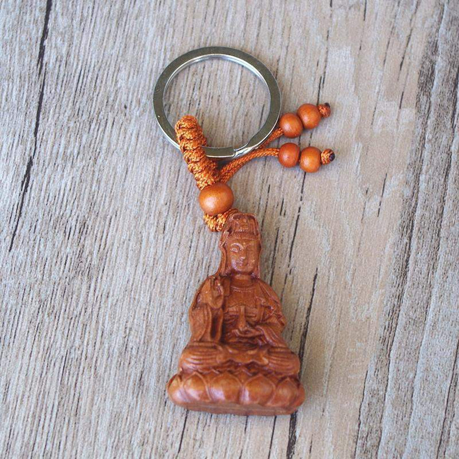 Porte-clés en bois de rose sculpté représentant un Bouddha