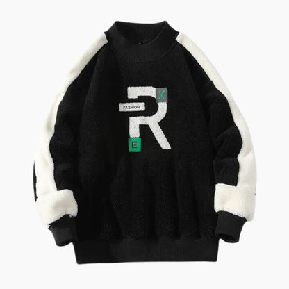 Gros plan sur le motif du pull noir et blanc
