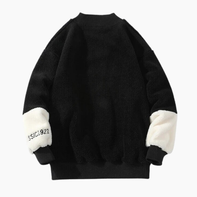 Pull polaire noir avec motif poitrine et manches blanches
